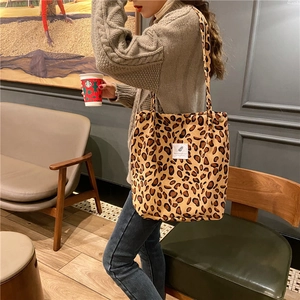 Leopard print corduroy tote bag showcased in a cozy cafe setting for a vintage aesthetic
