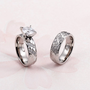 Textured 18k gold couple ring set with round white diamond and pavé side stones