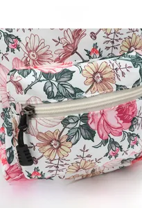 Detail of floral daisy print on canvas backpack with white zipper and black puller cord