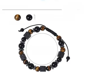 Detail view of 8mm tiger eye and obsidian beads on adjustable braided rope bracelet