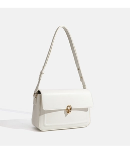 Detail of white leather shoulder bag featuring a modern gold double-ring buckle