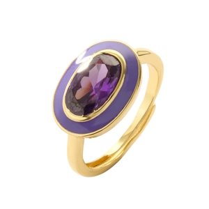 Close-up of golden adjustable ring featuring a purple oval stone and enamel detail