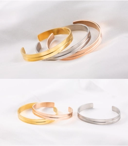 Detailed view of three-color stainless steel C-shape bracelets with brushed grooved finish