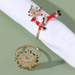 Creative Christmas napkin rings featuring red rhinestone elk and green enamel flower wreath