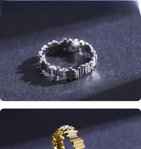 Detail of S925 silver and gold rings with geometric irregular bars and zircon pavé