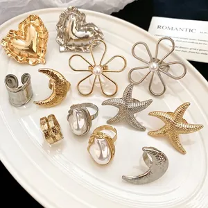 Set aus doppellagigen Faltenringen mit Herz-, Seestern- und Perlendesign in Gold und Silber