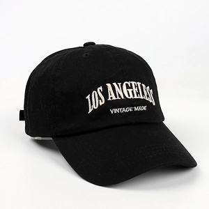 Detailed close-up of Los Angeles vintage embroidery on a black washed cotton baseball cap
