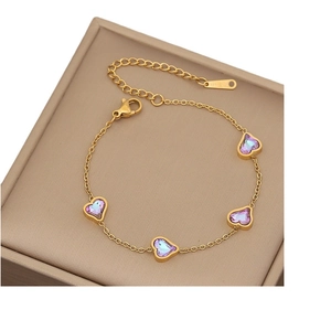 Gold stainless steel bracelet featuring purple heart crystals and butterfly charms