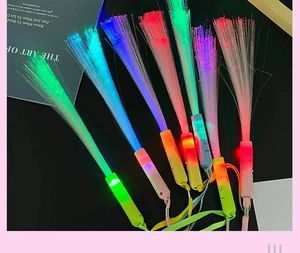 Macro view of colorful LED fiber optic sticks with glowing lights for party events
