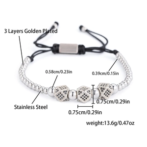 Detail view of woven bracelet with stainless steel cubic beads and dimension markings