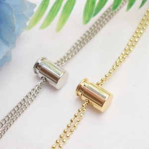 Macro shot of 14K gold-filled cylindrical adjustable sliders for DIY jewelry making