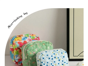 Quilted floral sanitary bag set in various patterns with a soft texture and top zipper
