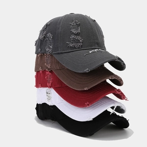 Five distressed baseball caps with frayed details and brim embroidery in various colors