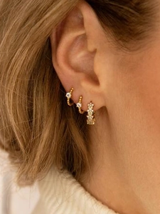 Luxury S925 silver needle gold hoop earrings with zircon stars on female model