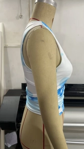 Detail of blue and white tie-dye sleeveless slim-fit top featuring y2k design