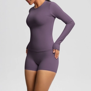 Detail view of purple yoga set featuring thumb holes on sleeves and high-stretch fabric