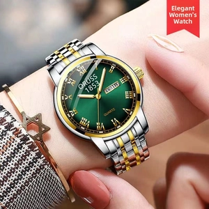 Detail of female quartz watch with green sunray dial and gold stainless steel band