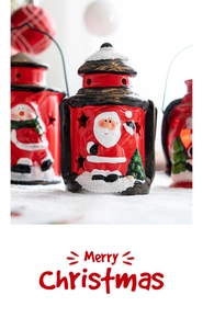 Detail of Christmas lantern with Santa Claus relief, star cut-outs and snow-like texture