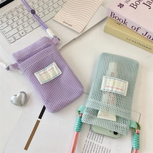 Detailed view of mesh phone pouches in lavender and mint with adjustable woven straps
