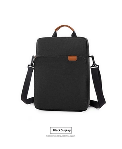 Vertical black oxford business bag with brown leather handles and adjustable strap