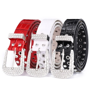 Three rhinestone studded faux crocodile leather belts in red, white, and black colors
