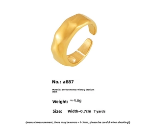 Detailed view of wide gold-plated steel ring featuring hammered texture and size 7 specs