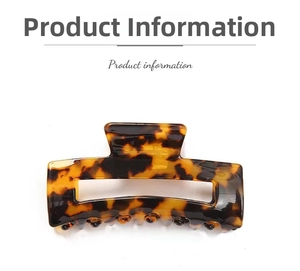 Detail view of rectangular leopard print acetate hair claw clip with hollow design