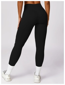 Detailed back view of high-waisted black yoga leggings with V-shaped contour stitching