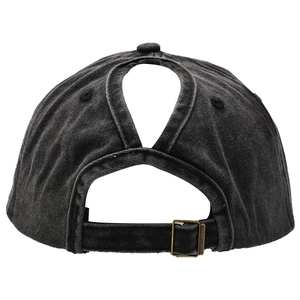 Detail view of the rear ponytail hole and adjustable metal buckle on a washed cotton cap
