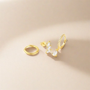 Detailed macro view of S925 sterling silver gold earrings set with marquise zircons