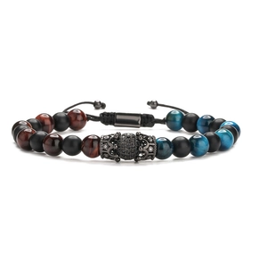 Men's crown bead bracelet with blue tiger eye and black stones on white background