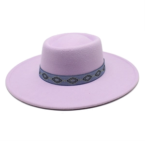 Detail of lavender wool felt hat featuring a vintage gold diamond pattern ribbon