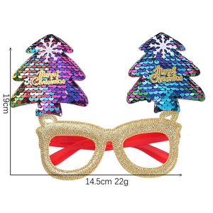 Detailed view of gold glitter Christmas tree glasses with multi-color sequins and Merry Christmas text