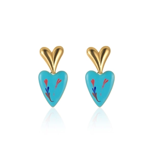 Detail of gold and light blue enamel heart drop earrings with feather pattern textures