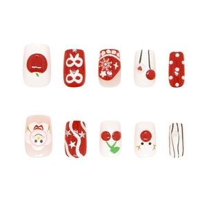 Handmade Christmas press-on nails with 3D snowflakes, bows, and festive red apple designs