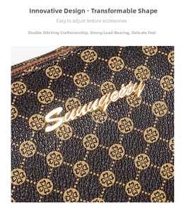Macro shot of dark brown litchi grain leather bag with clover pattern and gold logo