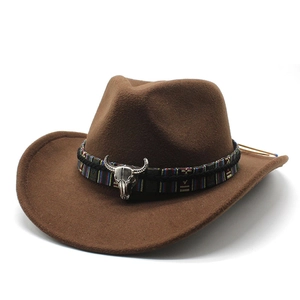 Brown western cowboy hat in felt with ethnic woven band and silver bull skull detail