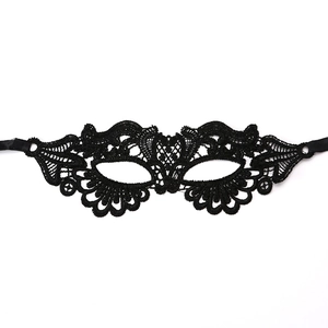 Detailed view of black hollow lace masquerade mask with intricate floral embroidery
