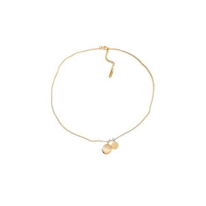 Minimalist gold snake chain necklace featuring a pink cat eye stone and round pendant