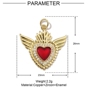 Macro shot of 26mm red heart pendant with gold wings and white cubic zirconia accents
