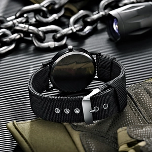 Close-up of tactical nylon strap and metal buckle on back of rugged sports watch