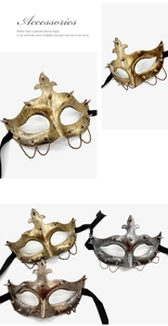 Close-up of vintage steampunk half-face mask featuring metallic spikes and hanging chains