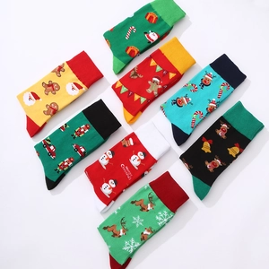 Set of 8 festive Christmas crew socks featuring Santa, reindeer, and snowman patterns