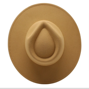 Overhead macro view of water-drop crown and stitching on khaki felt fedora hat