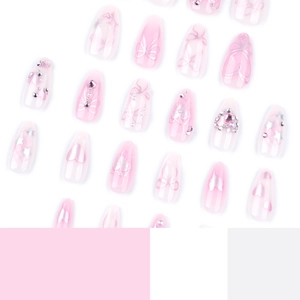 Pink almond press-on nails set with 3D bows, crystal hearts, and glitter decorations