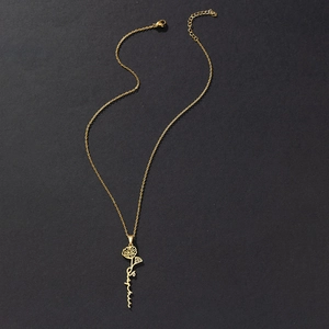 Detail of custom gold stainless steel necklace with poppy flower and Sophia name pendant