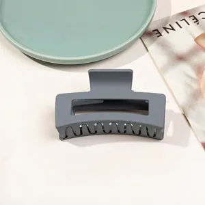 Detail view of large matte grey hair claw clip showing smooth finish and durable spring