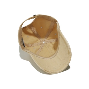 Detailed inner view of distressed New York baseball cap with six-panel structure and strap