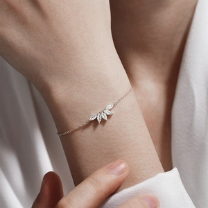 Detailed view of S925 sterling silver bracelet with five marquise-cut zircons on a wrist