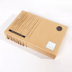 Minimalist Christmas kraft gift box with Peace Love Joy tape and name tag label